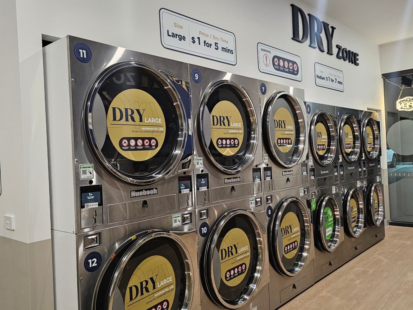 The LuxeSpin Dry Zone with stacked high-capacity commercial dryers
